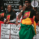 Cameroonian protesters calling for “national unity” demonstrate outside President Paul Biya’s hotel in New York